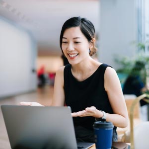 Woman coaching remotely in front of computer